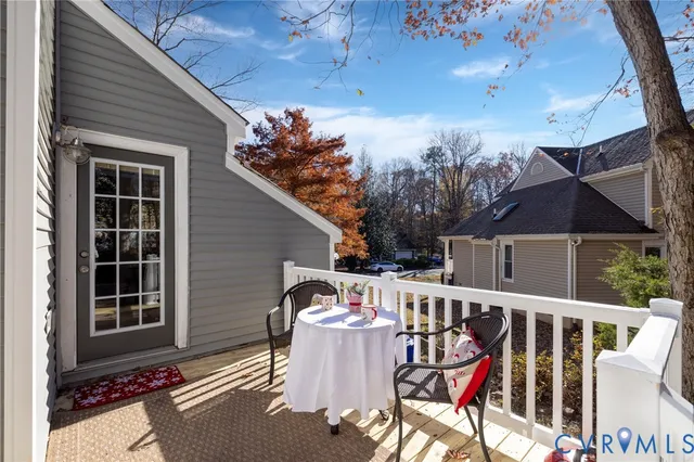 a view of a patio with a table and chairs