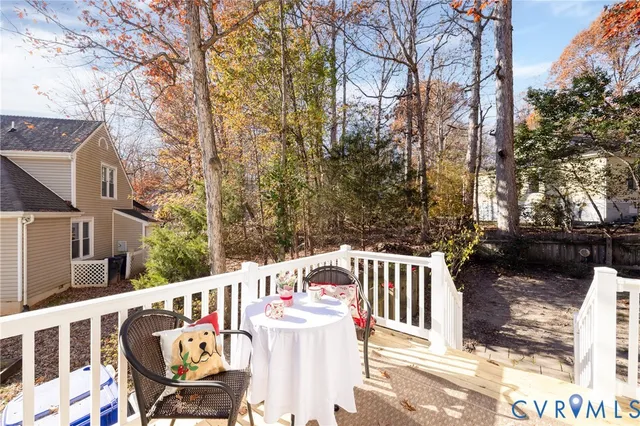 a view of a chairs and tables in the balcony