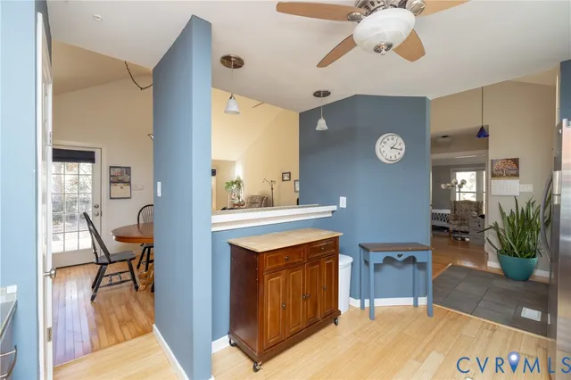 a view of a livingroom with furniture and a kitchen