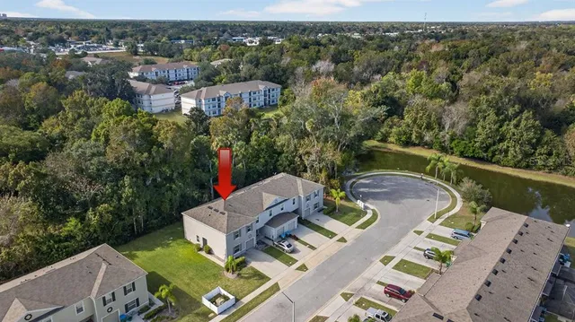 an aerial view of a house with outdoor space