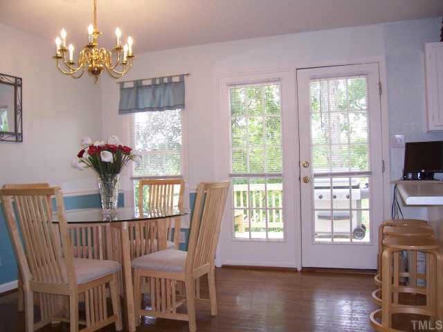 613 Thistlegate Trail Raleigh, NC 27610 - Photo 5 of 10 Spacious Eat-in Kithen w/Breakfast bar and access to Deck and Private Yard