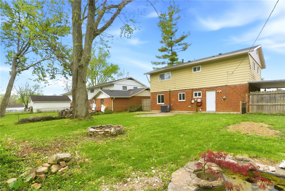 40 Woods Road Springboro, OH 45066 - Photo 5 of 57 This spacious backyard offers ample green space and a dedicated fire pit for outdoor enjoyment.