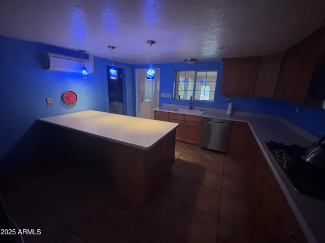 a view of a livingroom with a hall and wooden floor