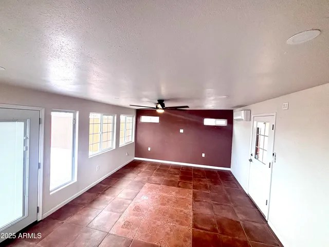 a bathroom with a sink mirror and toilet