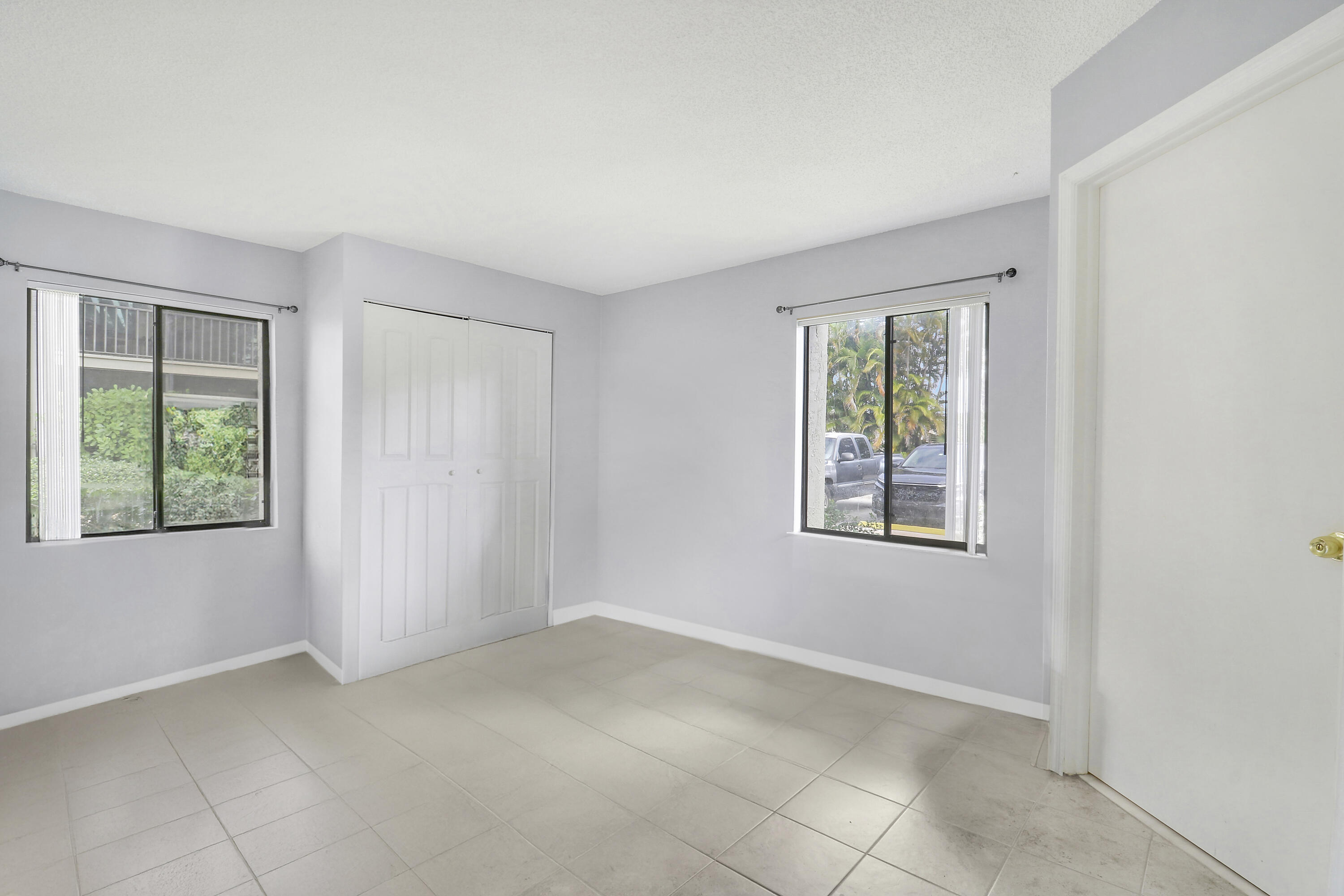 150 Pineview Road, Unit C4 Jupiter, FL 33469 - Photo 11 of 18 an empty room with windows