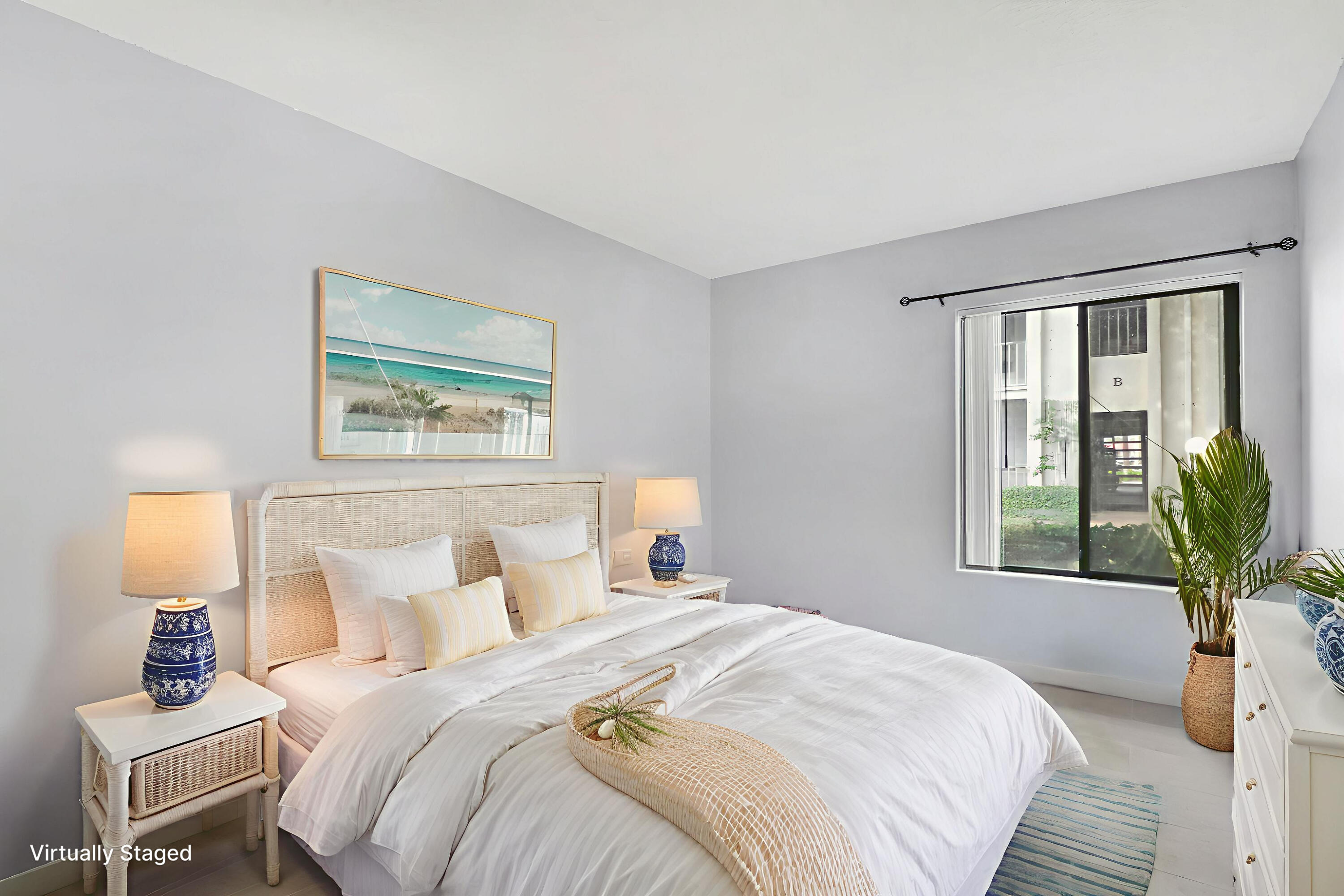 150 Pineview Road, Unit C4 Jupiter, FL 33469 - Photo 14 of 18 a bedroom with a bed and a window