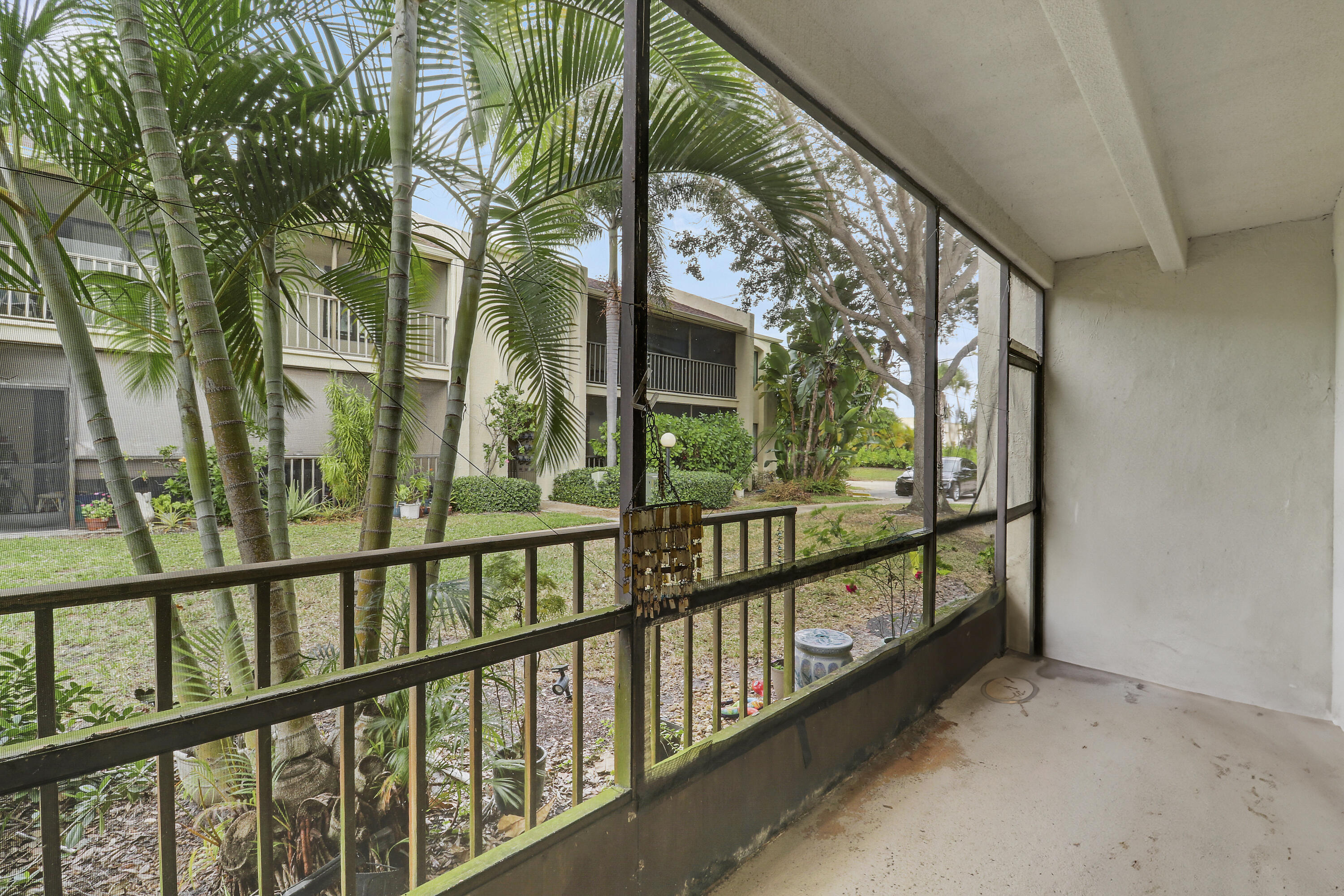 150 Pineview Road, Unit C4 Jupiter, FL 33469 - Photo 17 of 18 a view of a large trees from a balcony