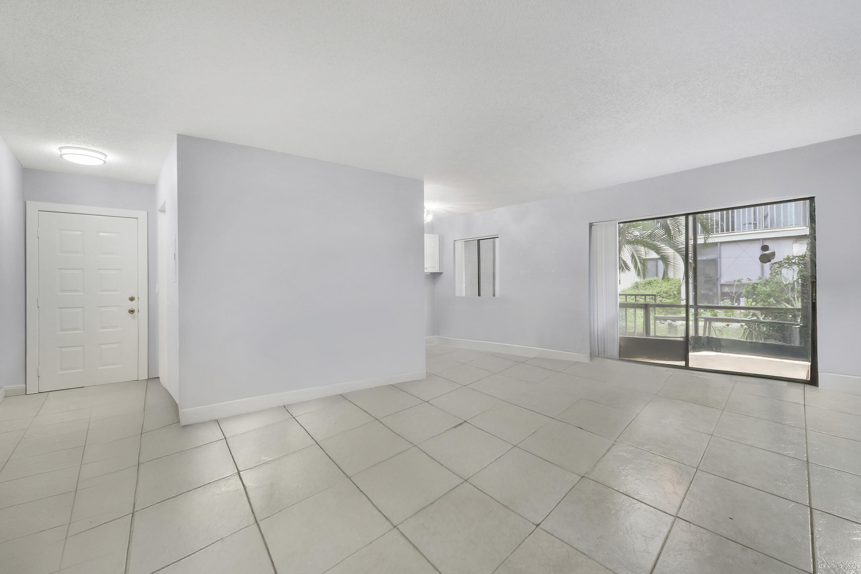 150 Pineview Road, Unit C4 Jupiter, FL 33469 - Photo 3 of 18 a view of an empty room with a window