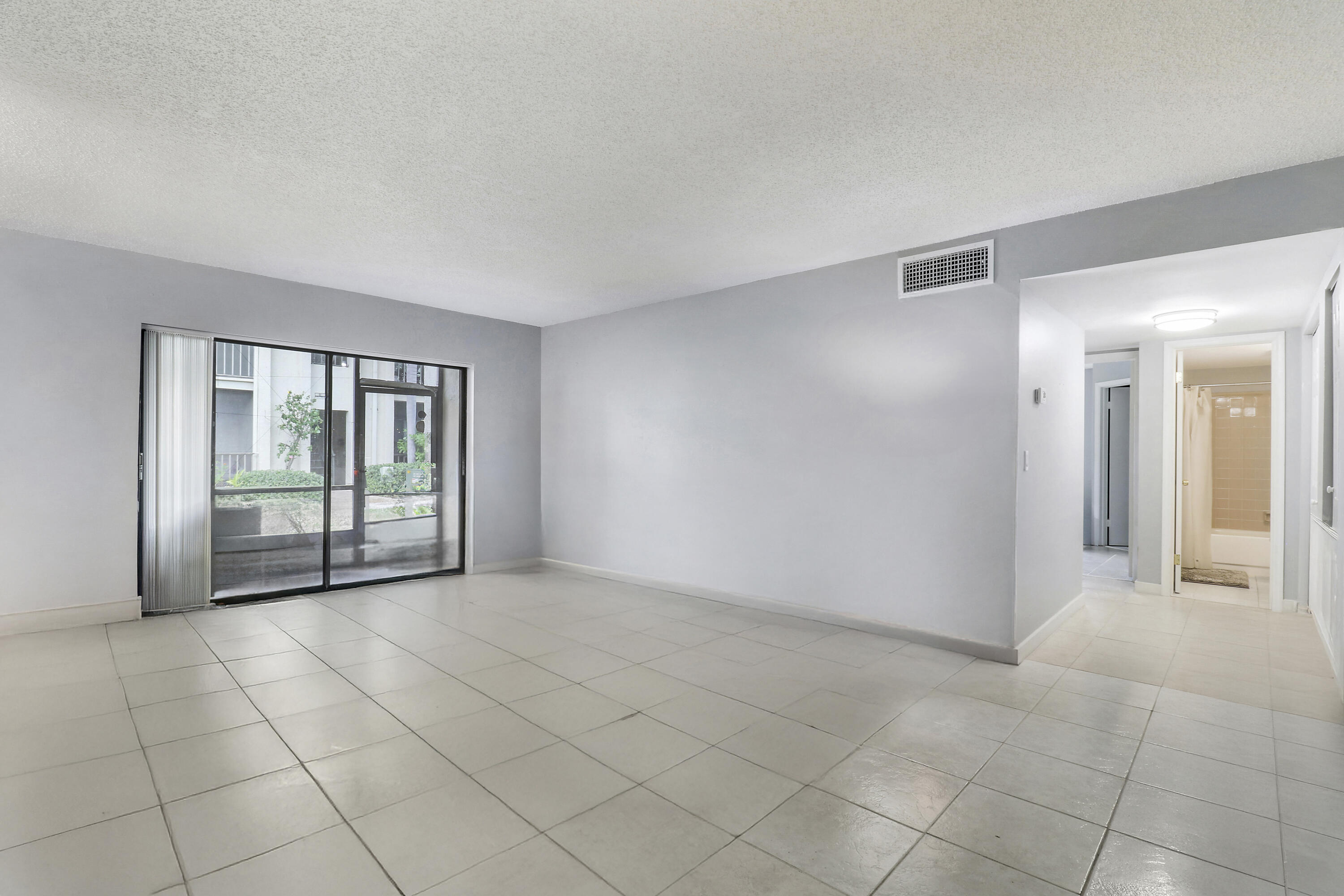 150 Pineview Road, Unit C4 Jupiter, FL 33469 - Photo 5 of 18 a view of an empty room and window