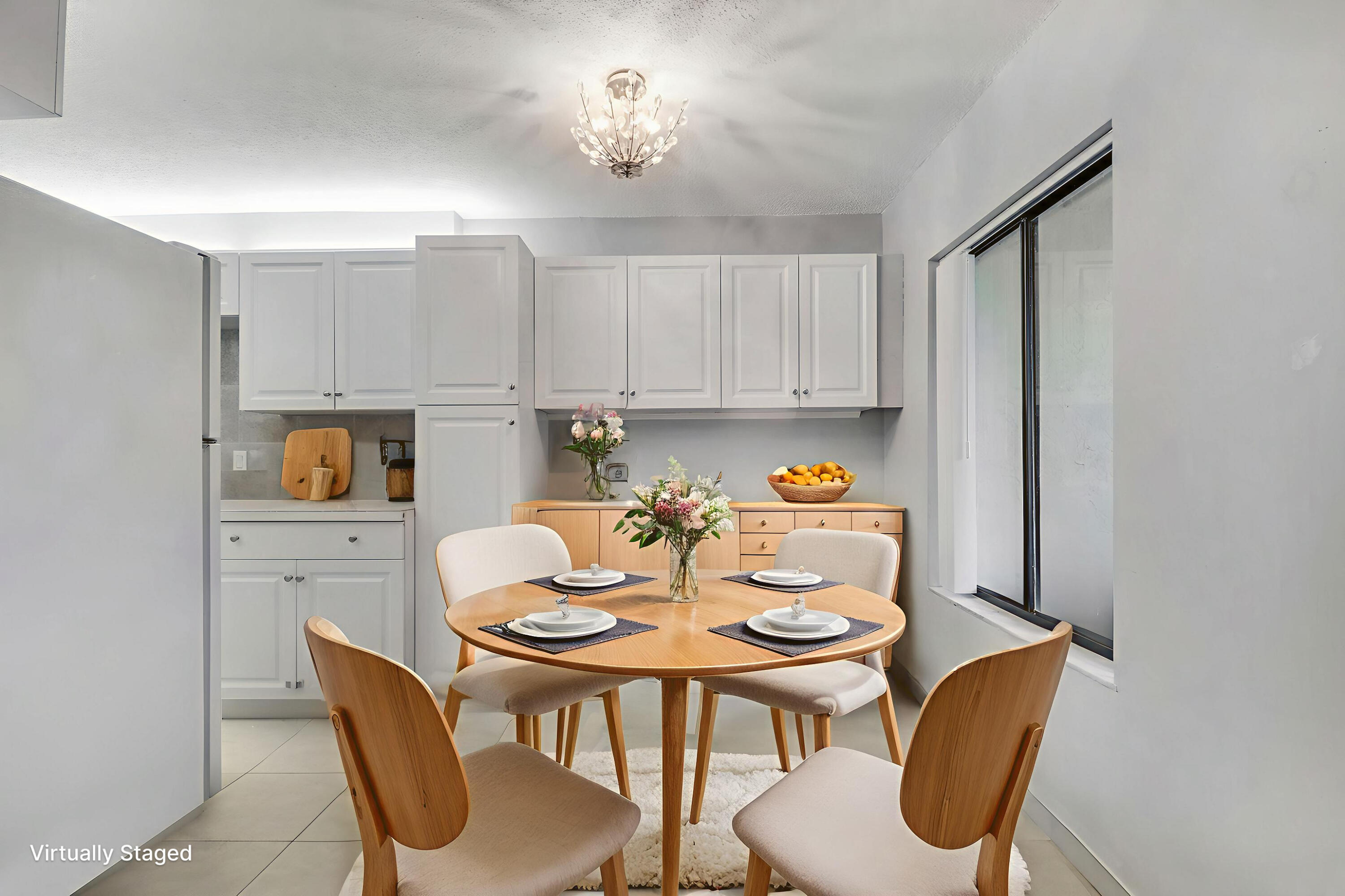 150 Pineview Road, Unit C4 Jupiter, FL 33469 - Photo 7 of 18 a view of a dining room with furniture and chandelier
