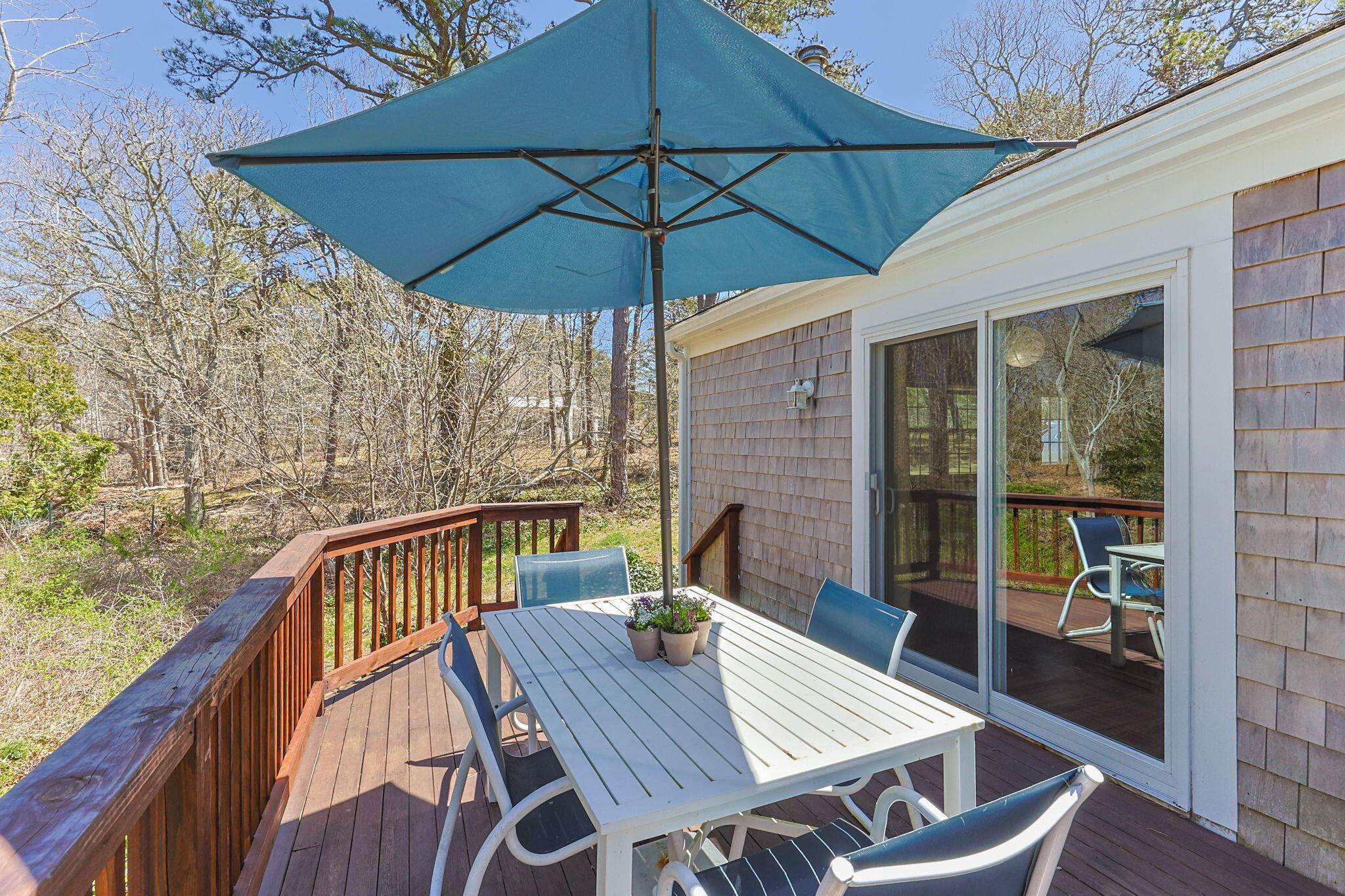 60 Long Avenue, Unit A Wellfleet, MA 02667 - Photo 22 of 28 a view of balcony with furniture and umbrella