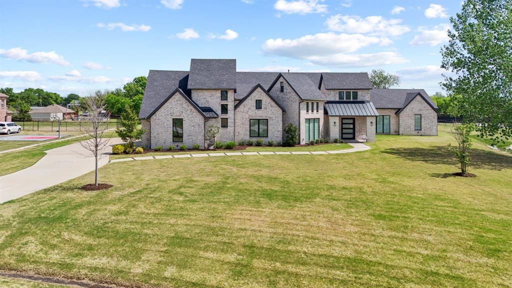 1285 Rimrock Drive Lucas, TX 75002 - Photo 1 of 37 a front view of a house with a yard