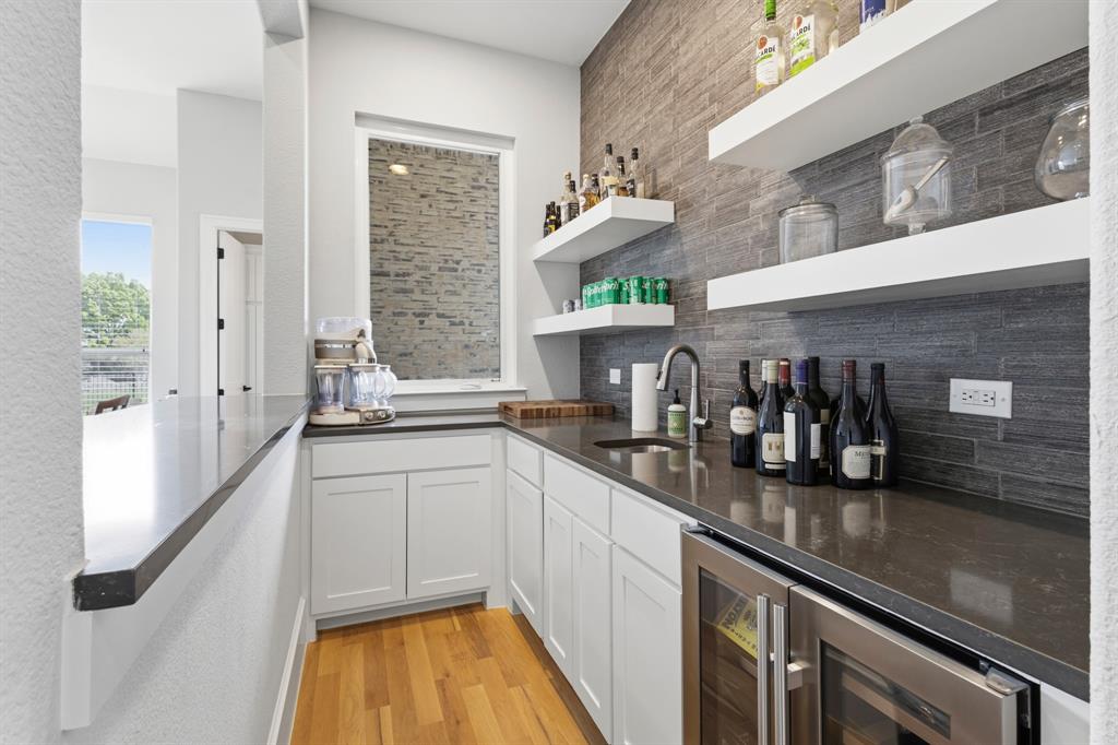 1285 Rimrock Drive Lucas, TX 75002 - Photo 17 of 37 a kitchen with stainless steel appliances a sink and cabinets