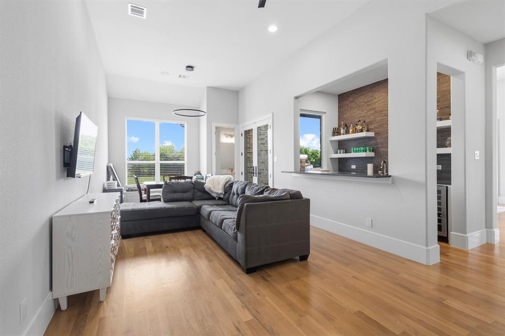 1285 Rimrock Drive Lucas, TX 75002 - Photo 18 of 37 a living room with furniture and a flat screen tv