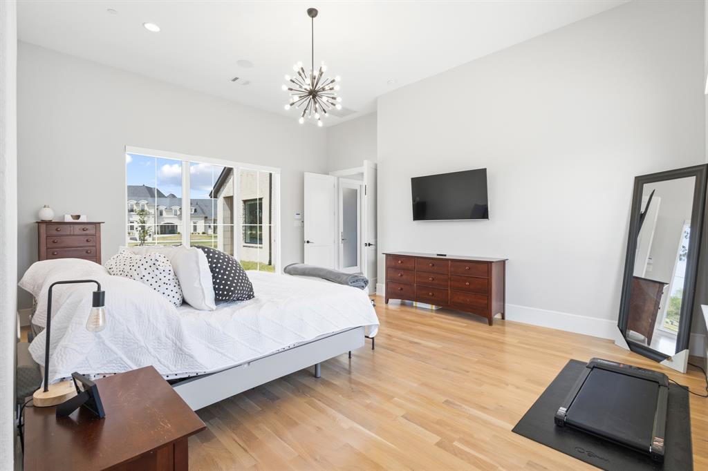 1285 Rimrock Drive Lucas, TX 75002 - Photo 22 of 37 a bedroom with a bed and a flat screen tv