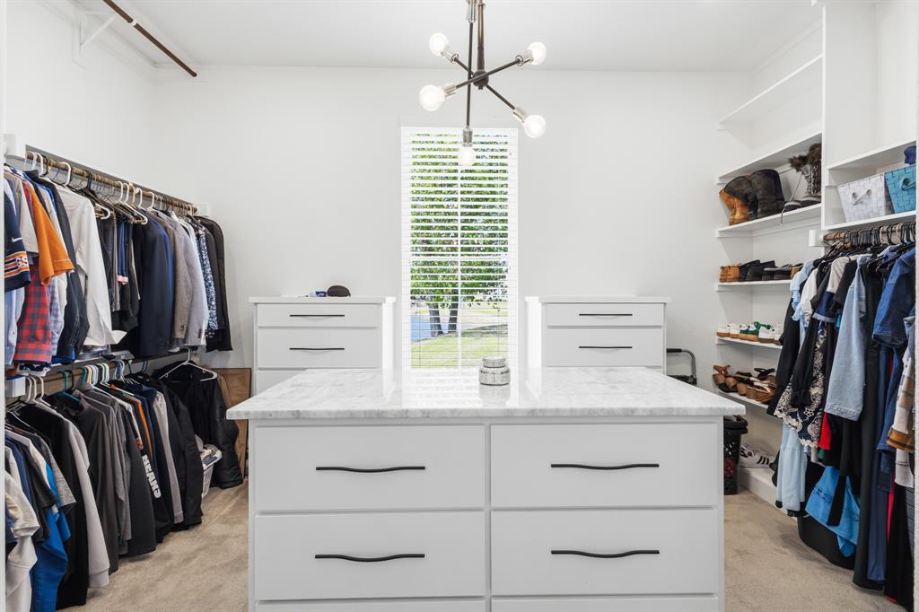 1285 Rimrock Drive Lucas, TX 75002 - Photo 26 of 37 a view of walk in closet with clothes and shoes