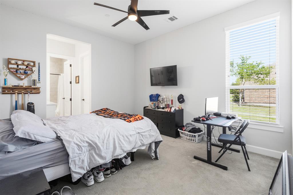 1285 Rimrock Drive Lucas, TX 75002 - Photo 27 of 37 a bedroom with a bed and a window