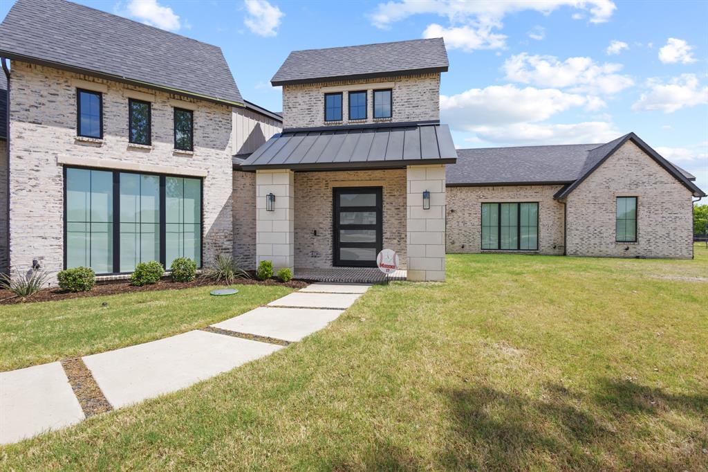 1285 Rimrock Drive Lucas, TX 75002 - Photo 3 of 37 a front view of a house with a yard