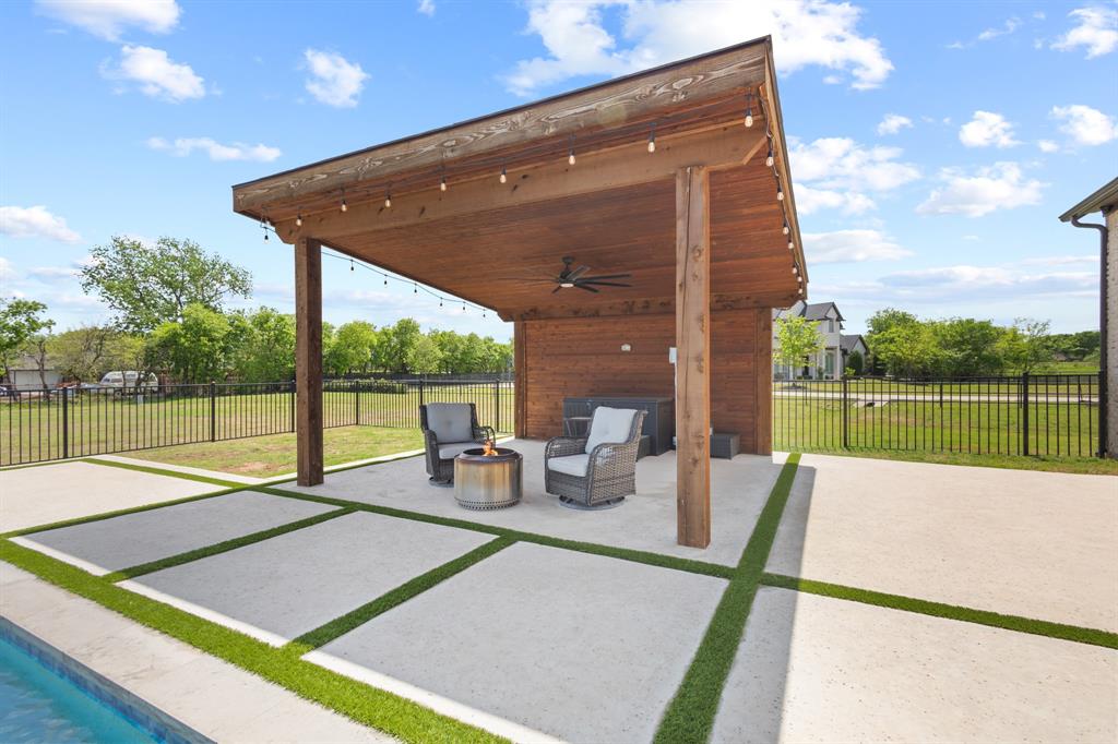 1285 Rimrock Drive Lucas, TX 75002 - Photo 35 of 37 a view of a patio with a table and chairs