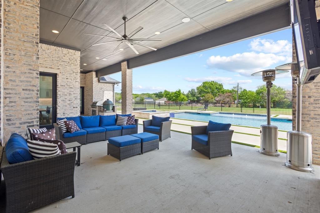 1285 Rimrock Drive Lucas, TX 75002 - Photo 36 of 37 a living room with furniture and a floor to ceiling window
