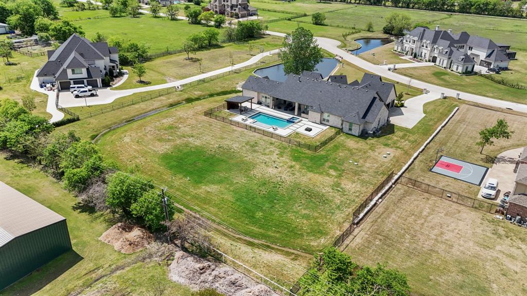 1285 Rimrock Drive Lucas, TX 75002 - Photo 6 of 37 an aerial view of a house with a garden and swimming pool