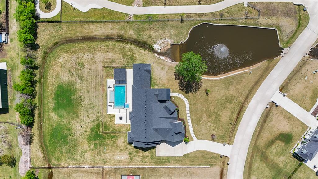 1285 Rimrock Drive Lucas, TX 75002 - Photo 7 of 37 an aerial view of a house with a yard