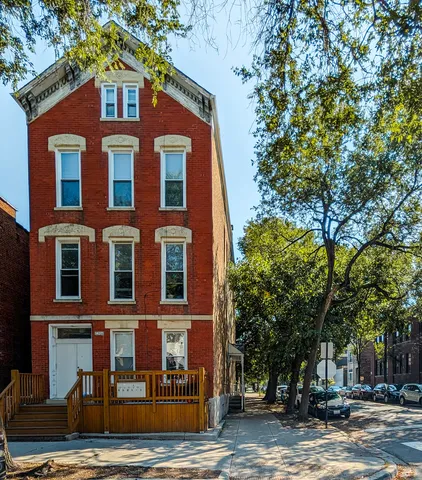 a view of a building with a street