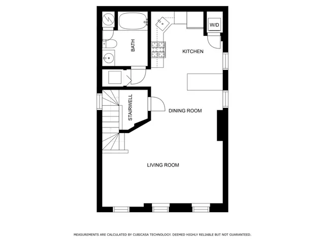 a picture of a bench in front of a wall