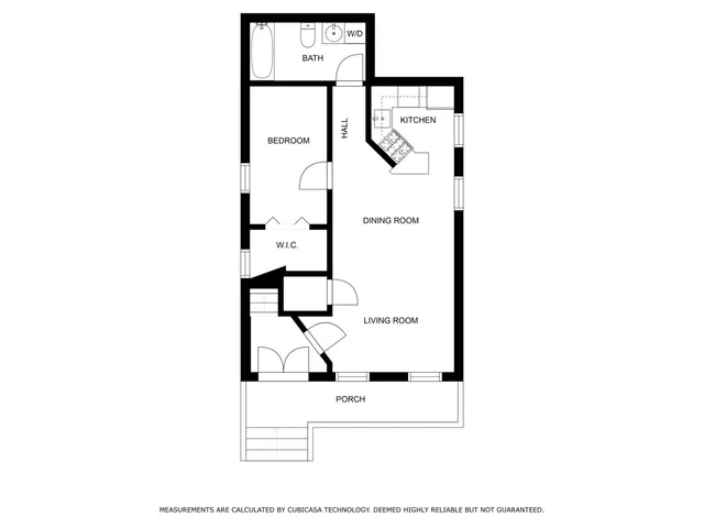 a picture of a bench in front of a wall