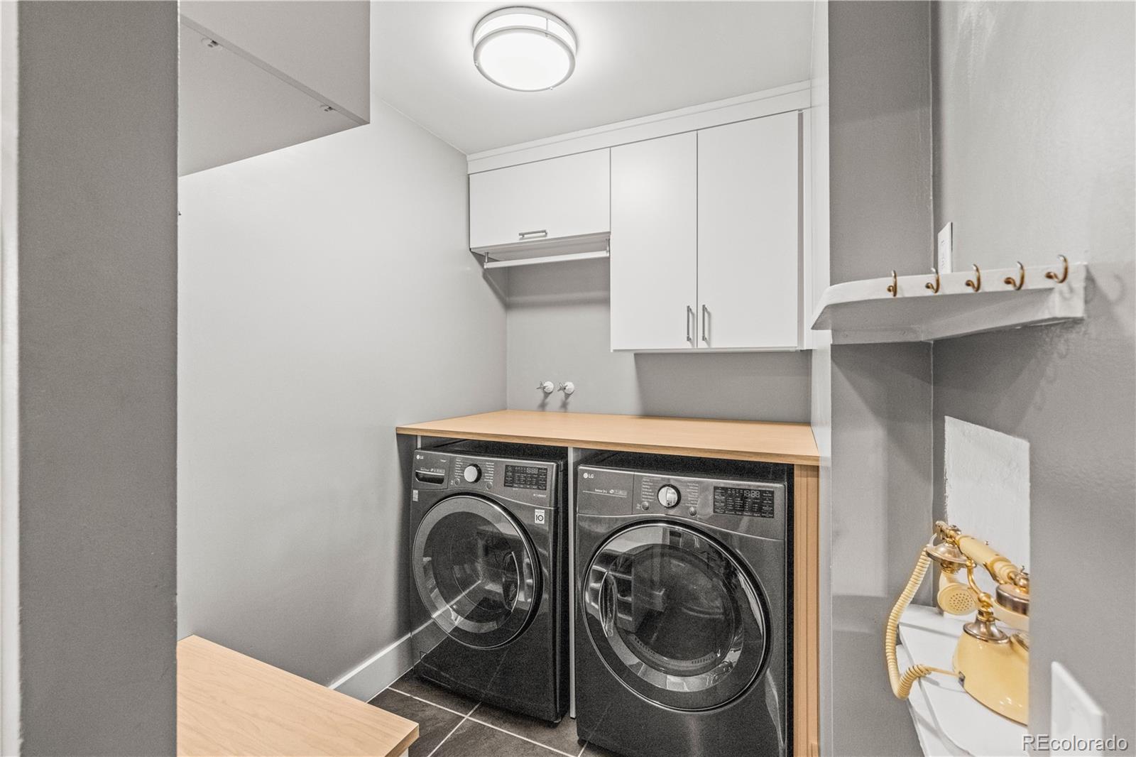 7005 West 44th Avenue Wheat Ridge, CO 80033 - Photo 12 of 37 a utility room with sink dryer and washer