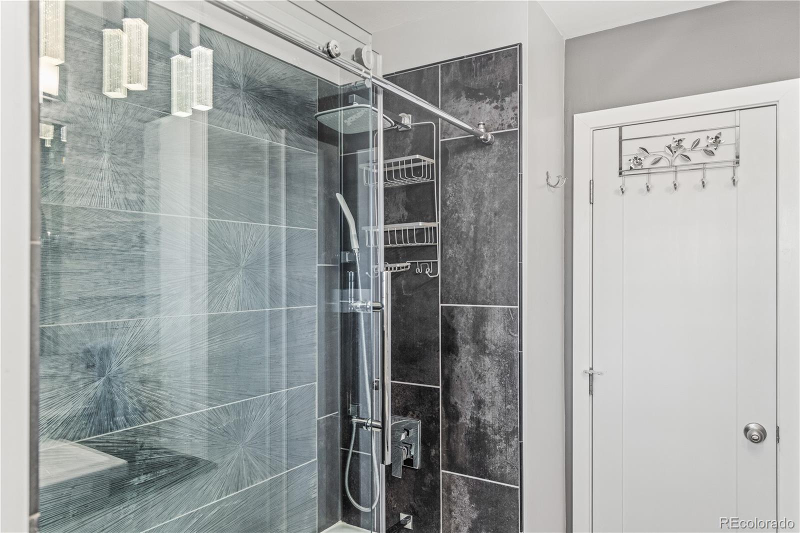 7005 West 44th Avenue Wheat Ridge, CO 80033 - Photo 19 of 37 a bathroom with a shower