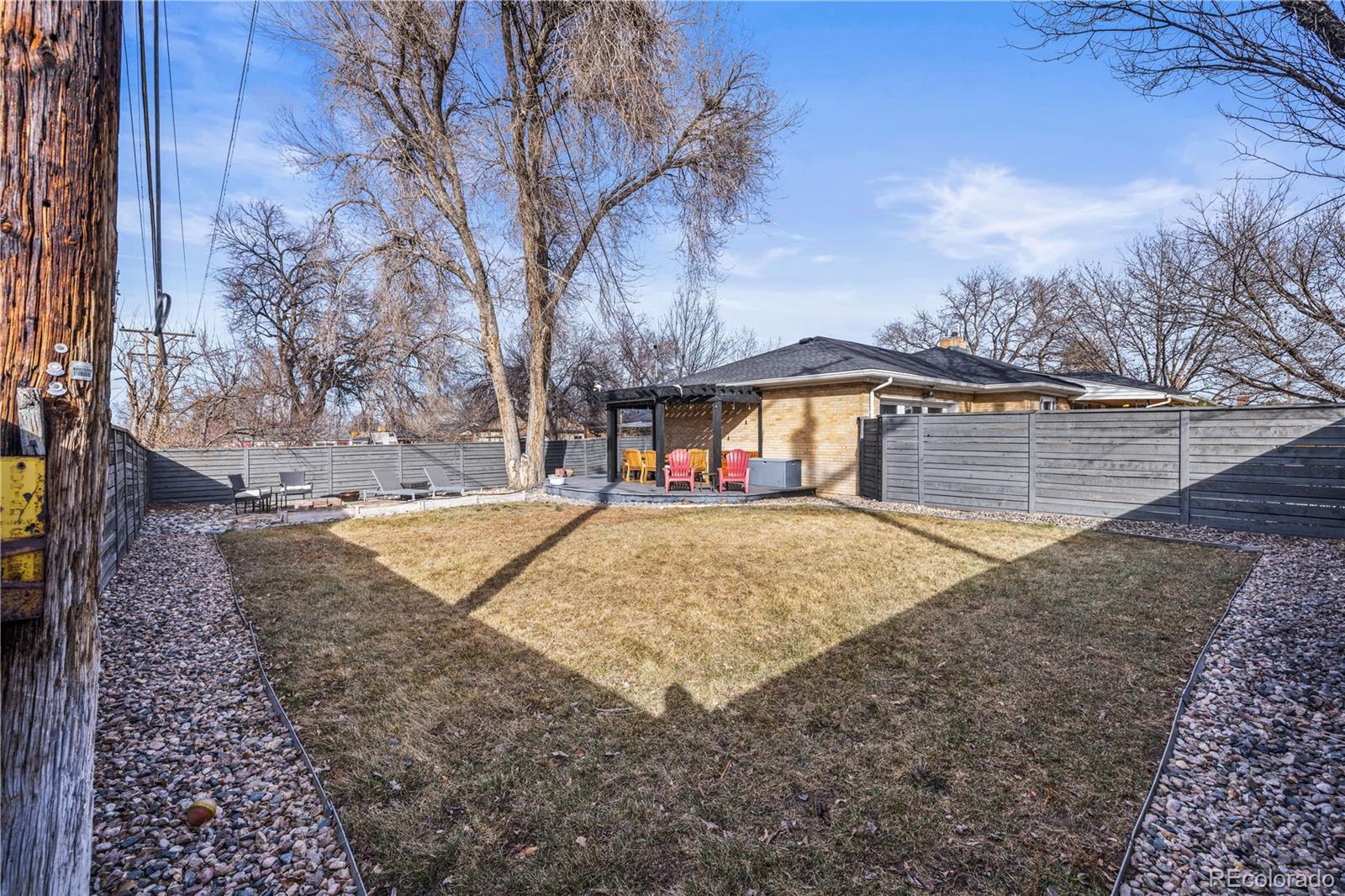 7005 West 44th Avenue Wheat Ridge, CO 80033 - Photo 34 of 37 a view of outdoor space yard and large tree
