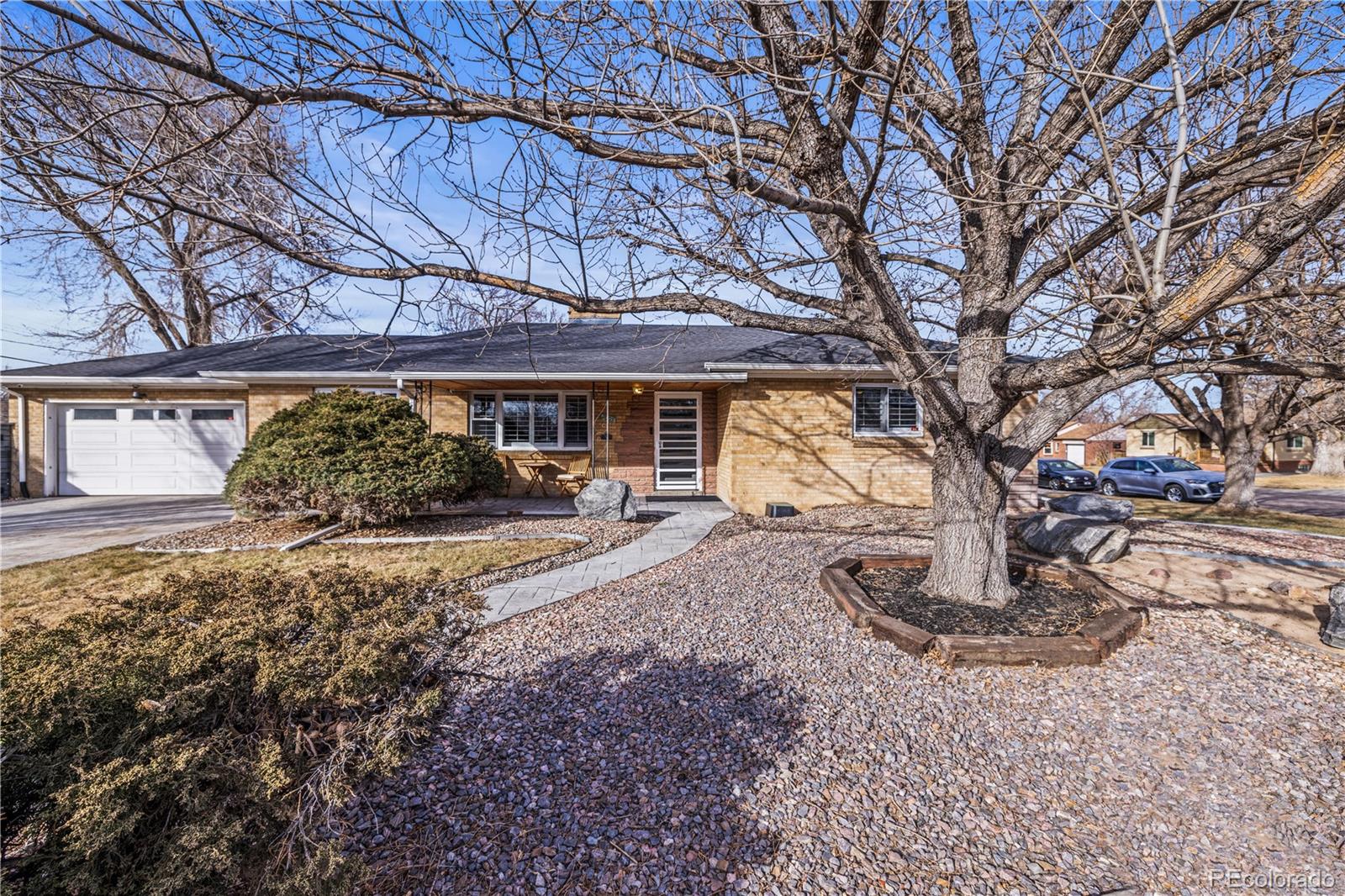 7005 West 44th Avenue Wheat Ridge, CO 80033 - Photo 36 of 37 a view of a house with large trees