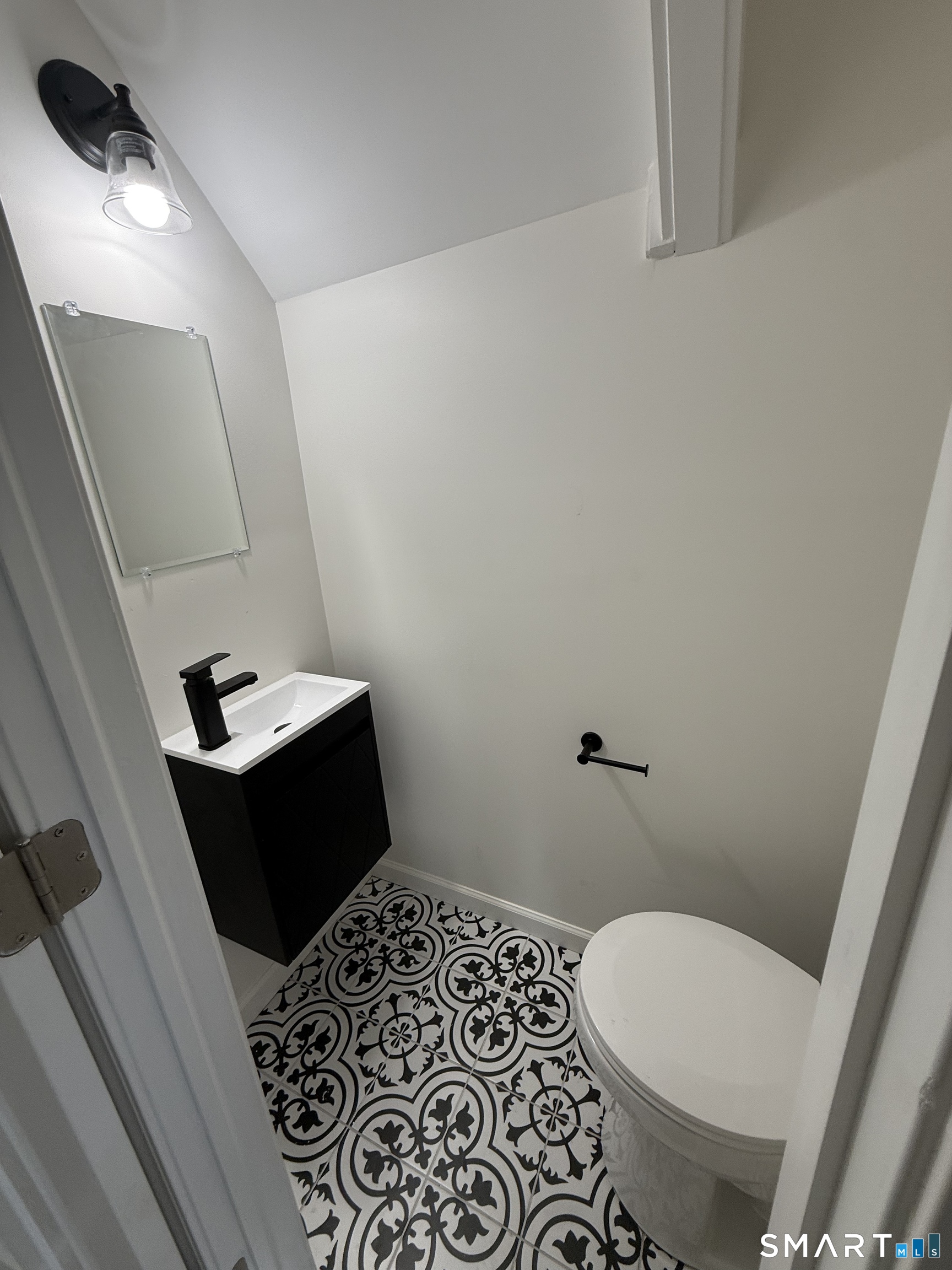 50 Jones Street West Haven, CT 06516 - Photo 9 of 21 a bathroom with a sink and toilet