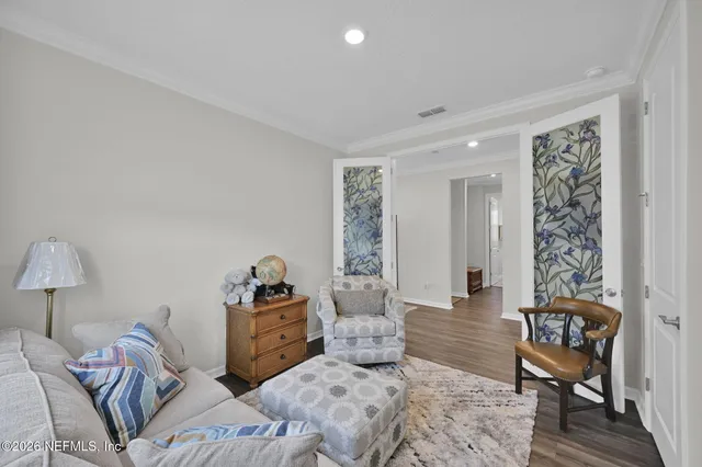 a bedroom with furniture and a window