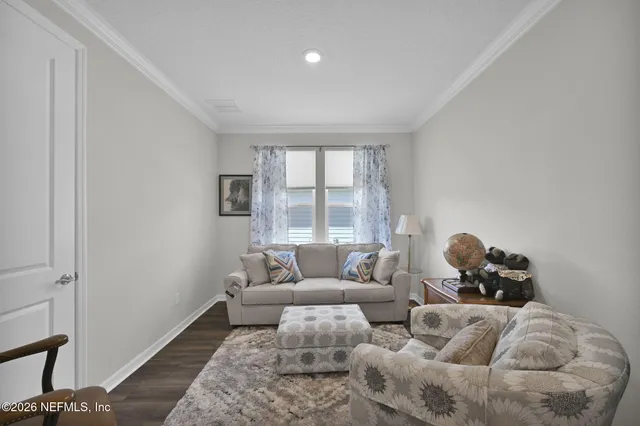 a living room with furniture and a window