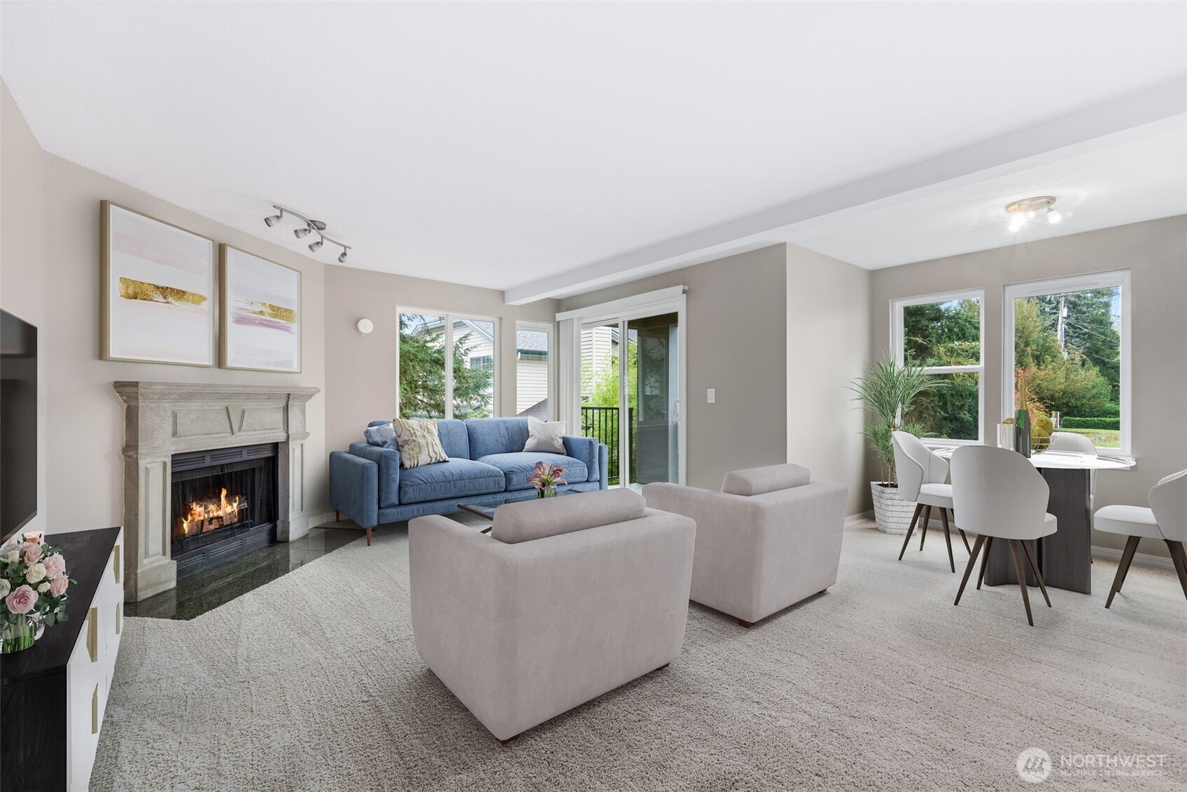 a living room with furniture and a fireplace