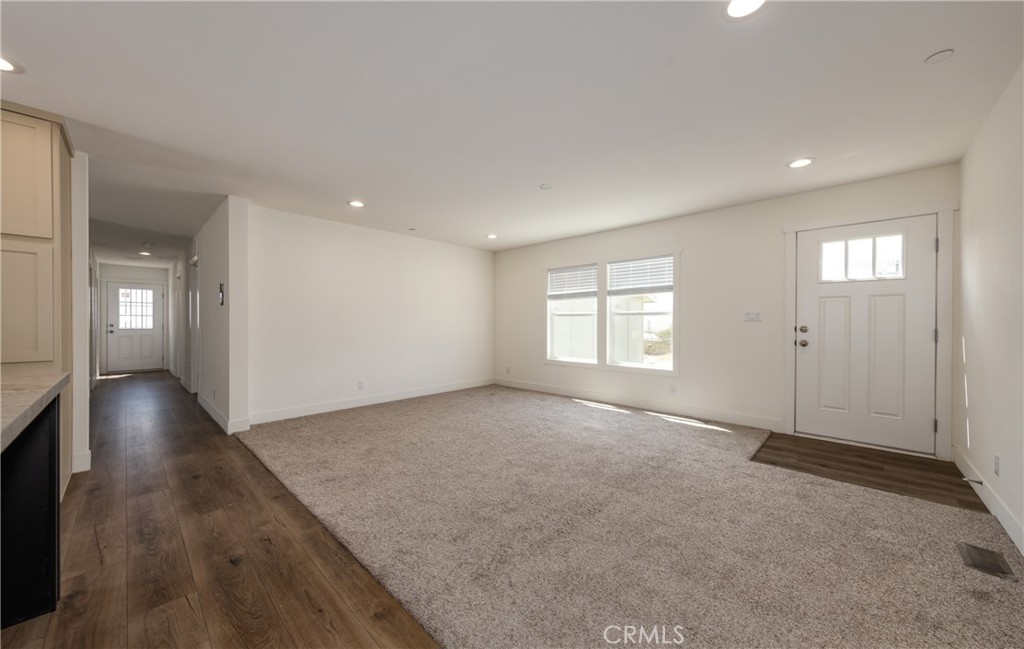 13435 Mesquite Road Whitewater, CA 92282 - Photo 14 of 29 an empty room with windows and entrance