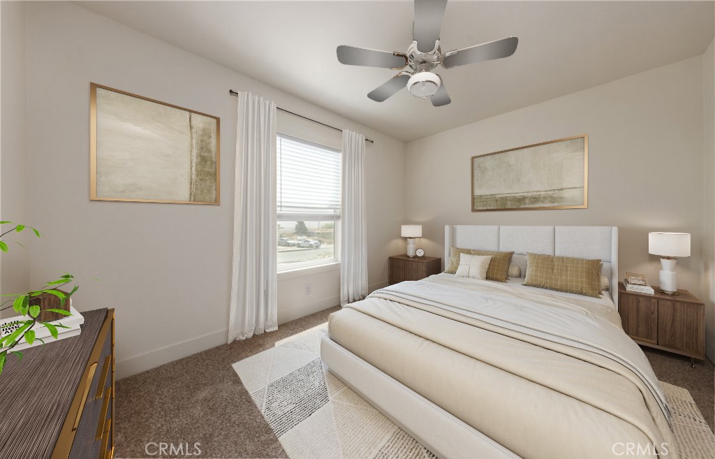 13435 Mesquite Road Whitewater, CA 92282 - Photo 28 of 29 a bedroom with a bed chandelier and a window