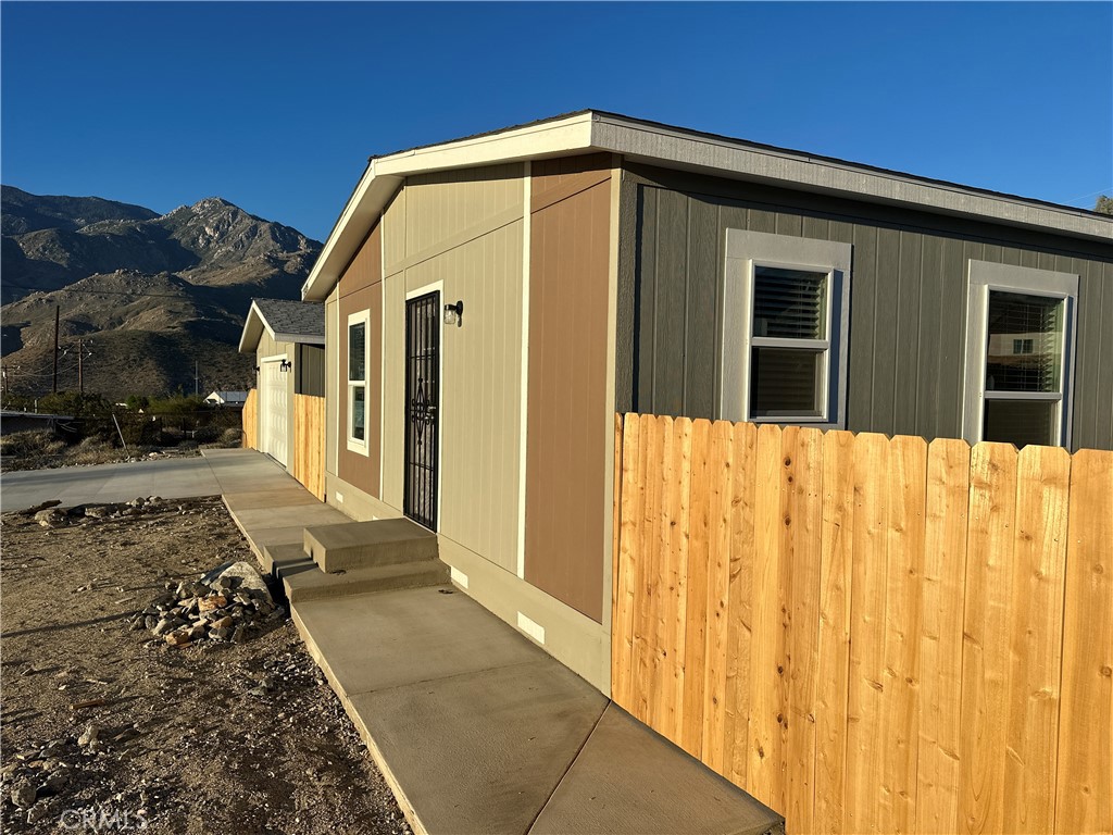 13435 Mesquite Road Whitewater, CA 92282 - Photo 4 of 29 a front view of a house with a yard