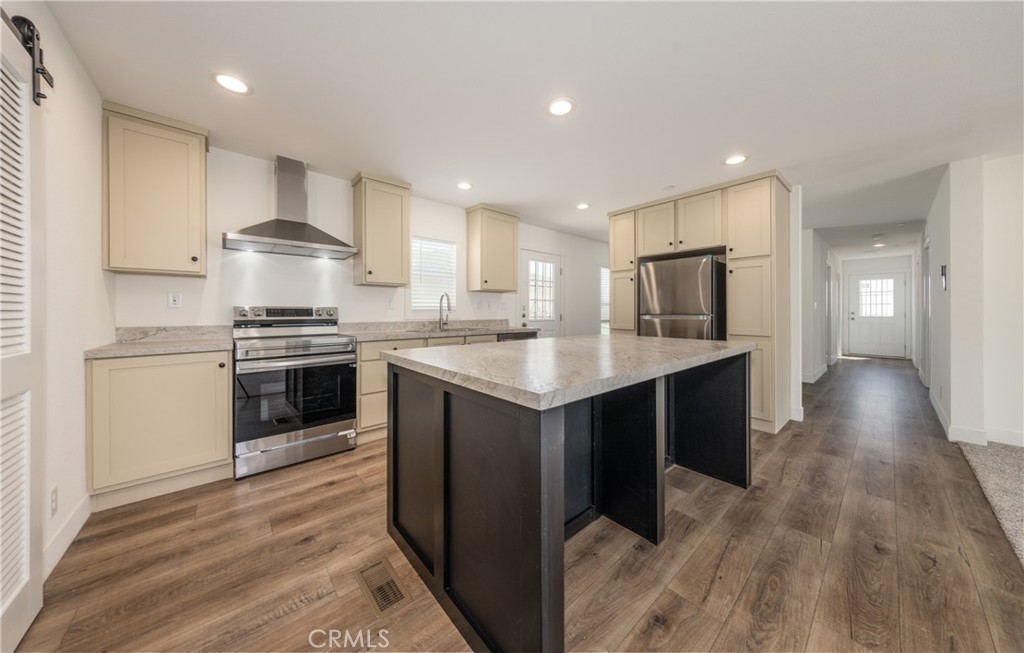 13435 Mesquite Road Whitewater, CA 92282 - Photo 7 of 29 a kitchen with kitchen island granite countertop a sink cabinets and stainless steel appliances