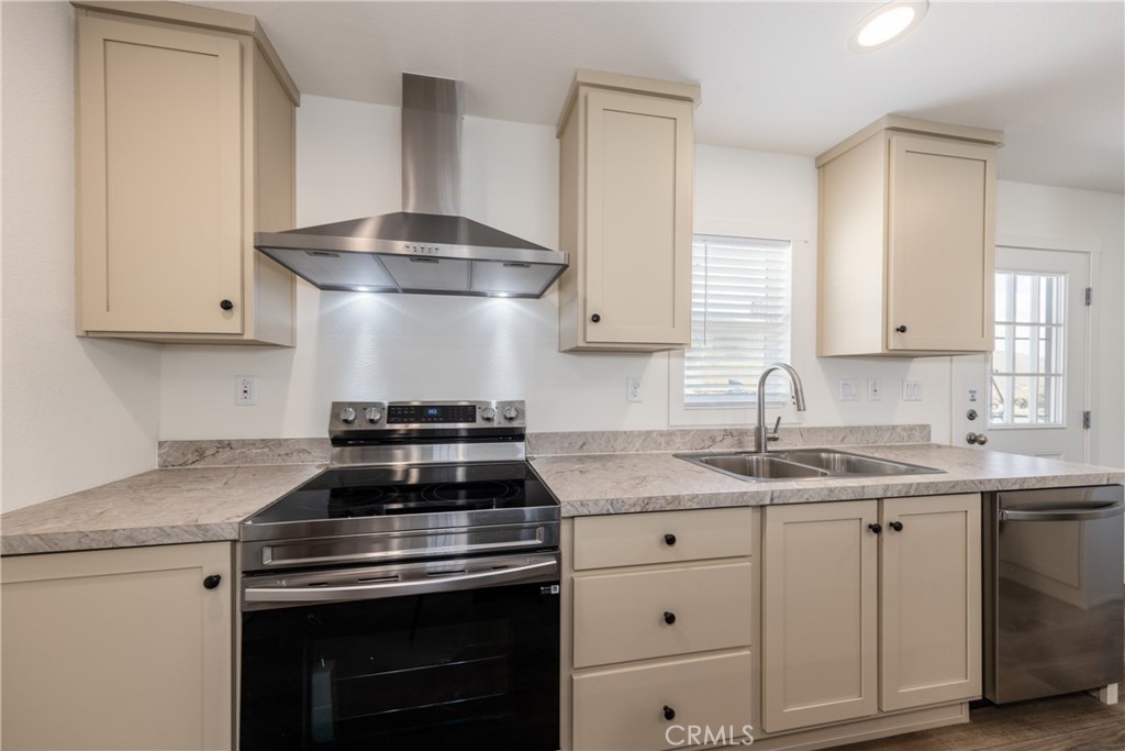 13435 Mesquite Road Whitewater, CA 92282 - Photo 8 of 29 a kitchen with granite countertop a stove sink and cabinets