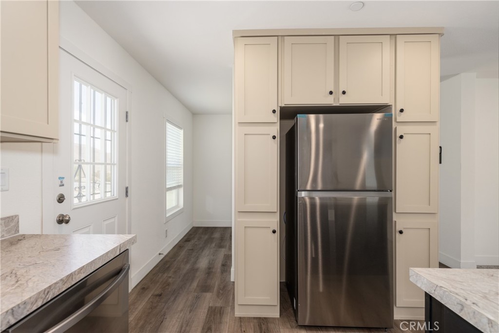 13435 Mesquite Road Whitewater, CA 92282 - Photo 9 of 29 a bathroom with a granite countertop sink and a refrigerator