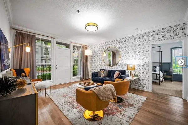 a living room with furniture and a flat screen tv
