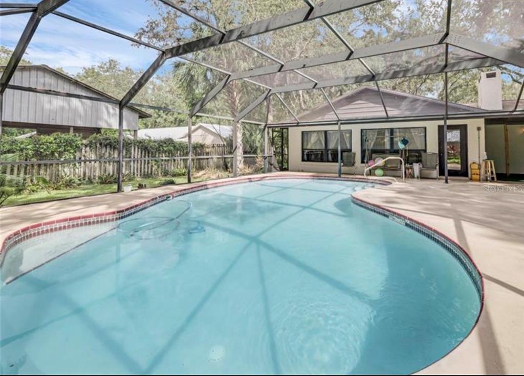 4308 Allen Road Fruitland Park, FL 34731 - Photo 28 of 33 a view of a house with sitting area and a small yard