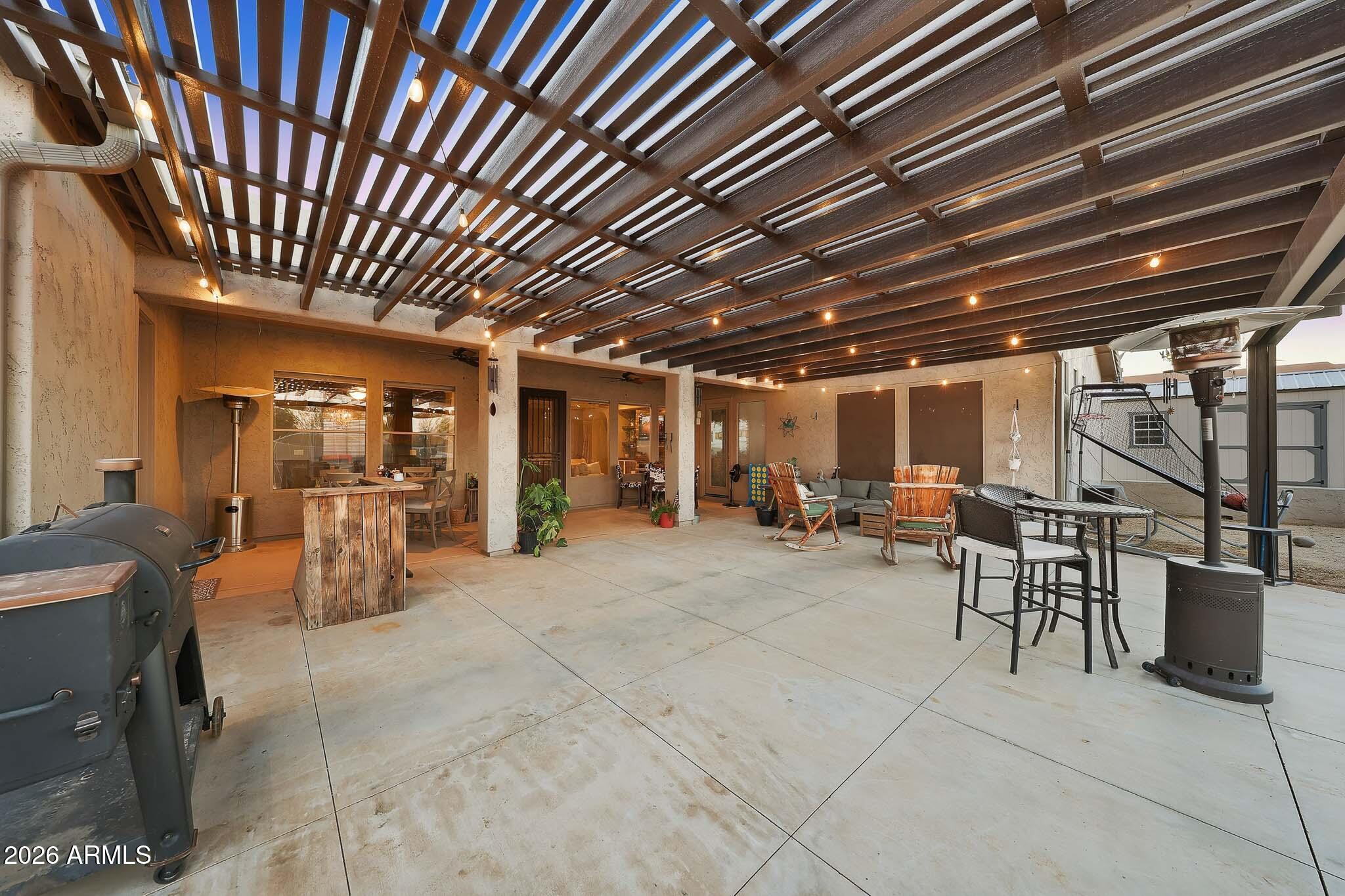 23024 West Sierra Ridge Way Wittmann, AZ 85361 - Photo 76 of 99 a view of a chairs and tables in patio