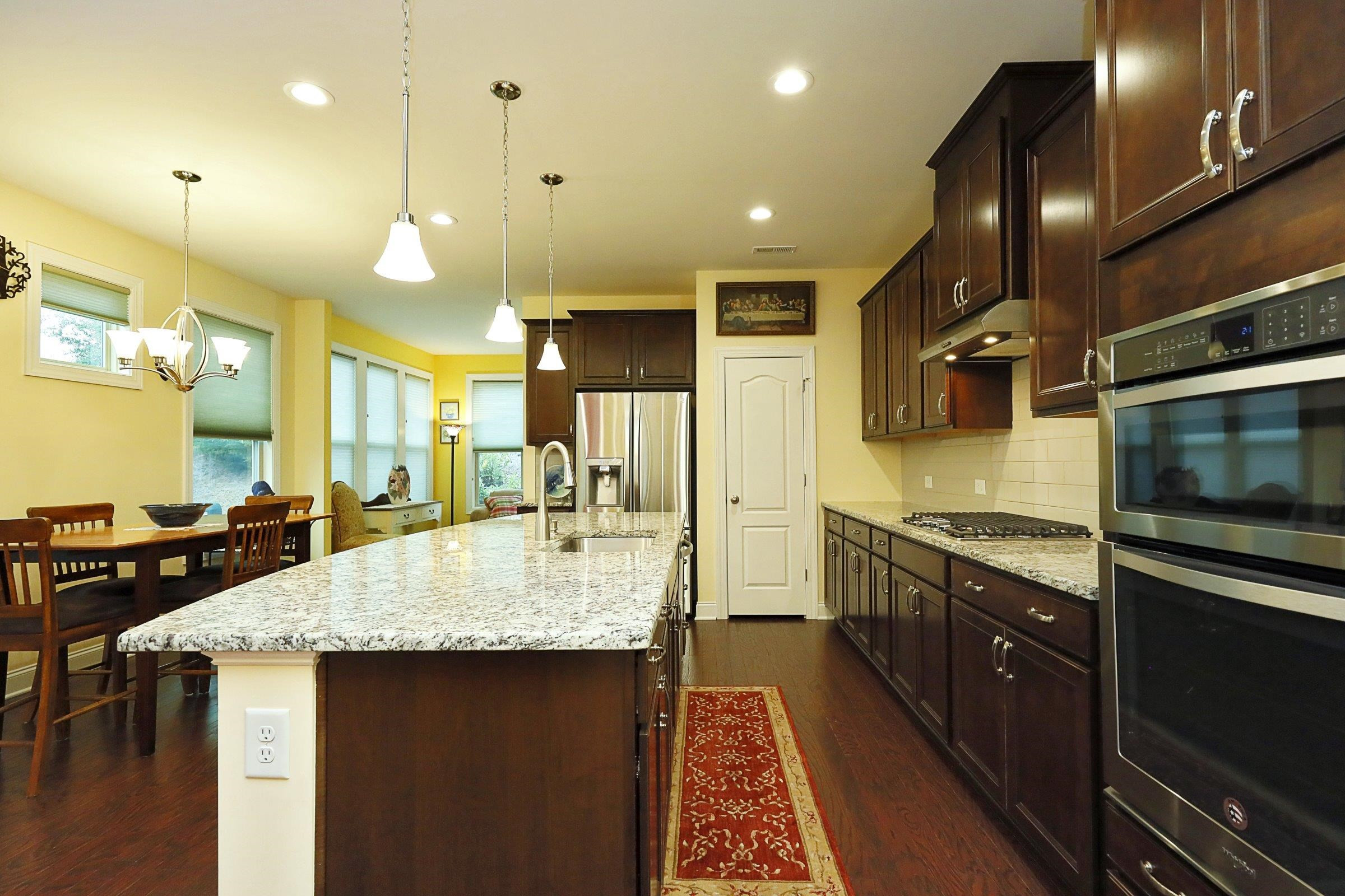 1241 Catch Fly Lane Durham, NC 27713 - Photo 11 of 44 a large kitchen with granite countertop lots of counter space and a sink