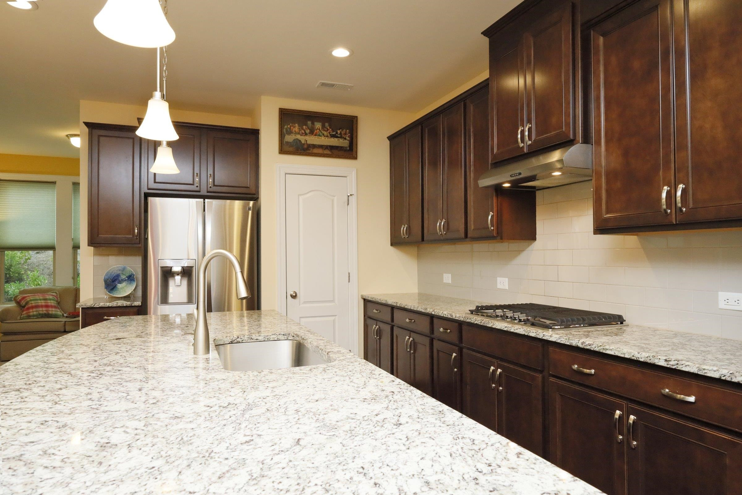 1241 Catch Fly Lane Durham, NC 27713 - Photo 12 of 44 a kitchen with stainless steel appliances granite countertop a sink a stove and a refrigerator