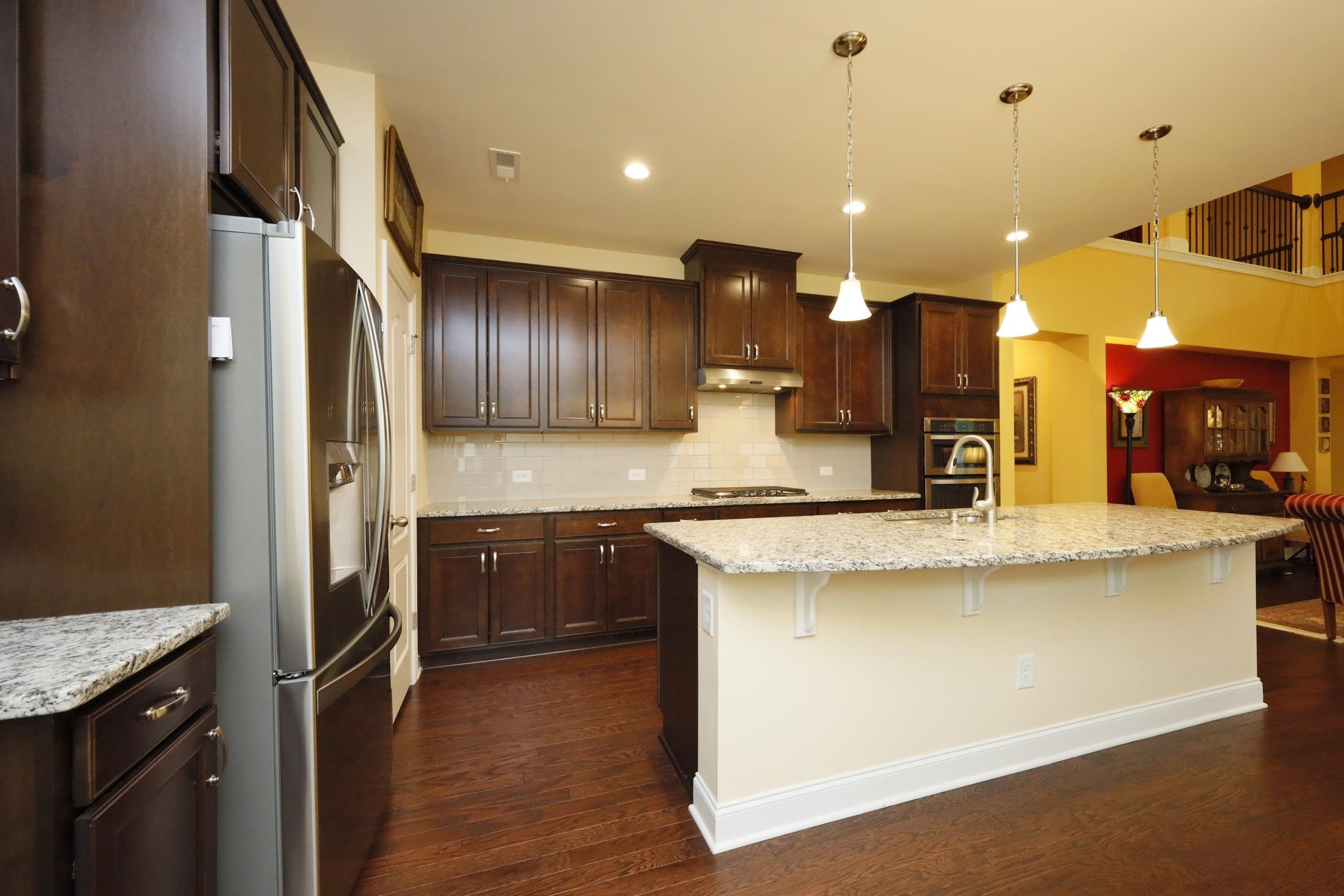1241 Catch Fly Lane Durham, NC 27713 - Photo 13 of 44 a kitchen with stainless steel appliances granite countertop a sink a stove and a refrigerator