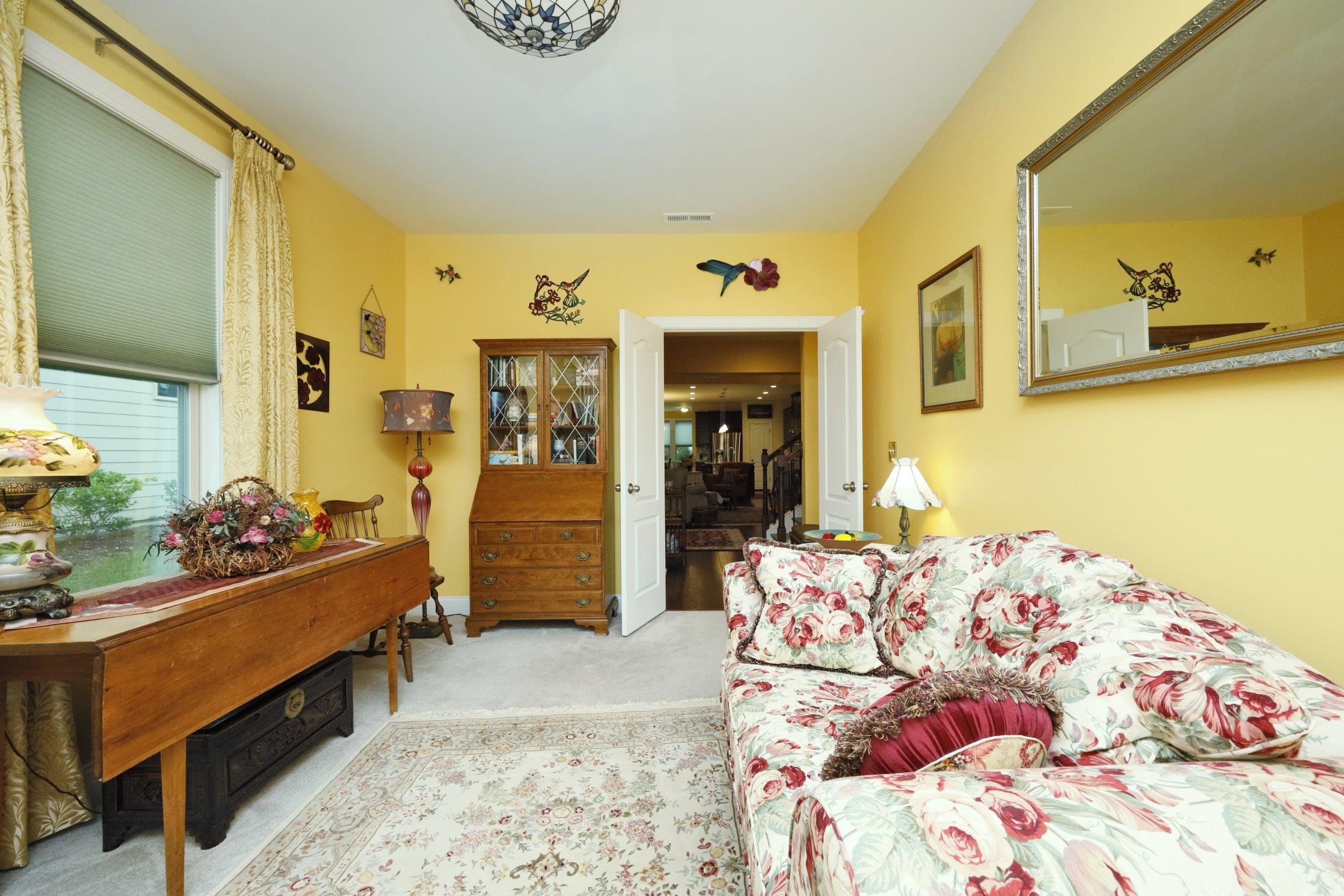 1241 Catch Fly Lane Durham, NC 27713 - Photo 21 of 44 a bedroom with a bed and wooden floor